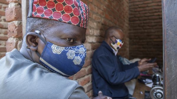 A man wears a face mask as preventive measure against the COVID-19 coronavirus inside Lilongwe City market in Lilongwe on May 18, 2020. AMOS GUMULIRA / AFP