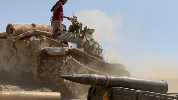 A fighter loyal to Yemen's separatist Southern Transitional Council (STC) stands atop a tank amid clashes with Saudi-backed government forces for control of Zinjibar, the capital of the southern Abyan province, in the Sheikh Salim area on May 23, 2020. Nabil HASAN / AFP