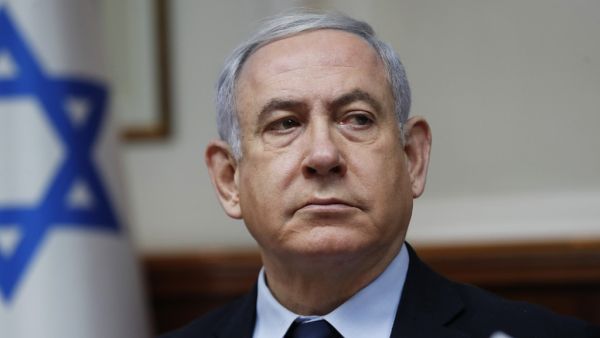 A file photo taken on February 9, 2020 shows Israeli Prime Minister Benjamin Netanyahu chairing the weekly cabinet meeting in Jerusalem. A new page in Israeli history opens Sunday as Prime Minister Benjamin Netanyahu becomes the first sitting premier to face criminal charges, accused of a string of corruption allegations he denies. After more than 500 days of electoral deadlock in which he fought for his political survival Netanyahu is to take his seat in the Jerusalem District Court for a new battle -- to 