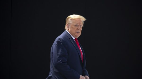 President Donald Trump waits on the rooftop of the Operational Building at NASA before the launch of the SpaceX Falcon 9 rocket with NASA astronauts Bob Behnken (R) and Doug Hurley aboard the rocket from the Kennedy Space Center on May 30, 2020 in Cape Canaveral, Florida. Saul MARTINEZ / GETTY IMAGES NORTH AMERICA / Getty Images via AFP