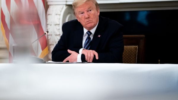 Trump insisted that the national economy will recover this year from the damage caused by novel coronavirus pandemic, saying, "I'm calling it the transition to greatness." Anna Moneymaker-Pool/Getty Images/AFP