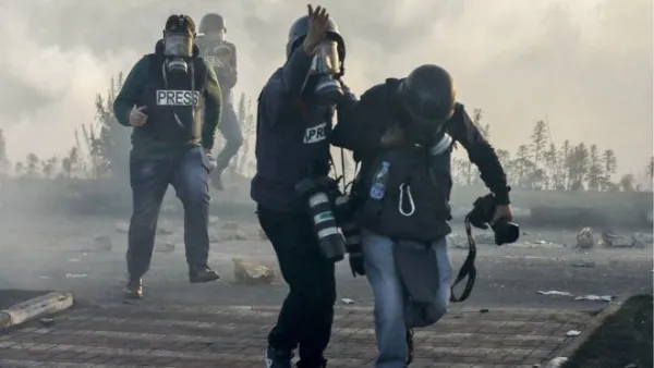 Journalists under fire (Abbas Momani/ AFP File Photo)