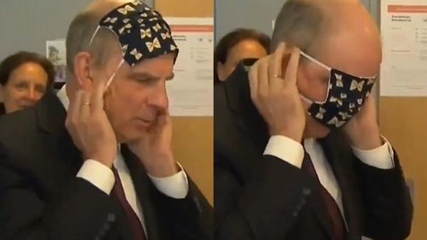 Koen Geens (pictured) was visiting a sewing shop in Wijgmaal, Belgium, where volunteers had made 35,000 fabric masks to help the country's coronavirus efforts. (Twitter)