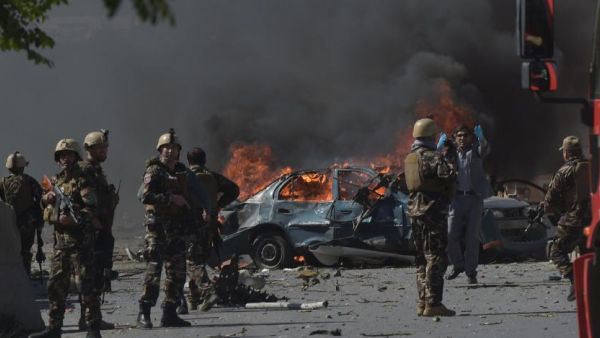 Afghan security forces personnel are seen at the site of a car bomb attack in Kabul on May 31, 2017. Shah Marai / AFP