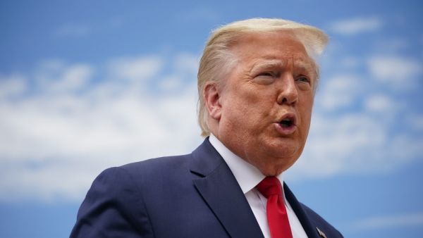 US President Donald Trump speaks to the press before boarding Air Force One as he departs from Joint Base Andrews in Maryland on May 30, 2020. Trump travels to Kennedy Space Center in Florida to watch the launch of the manned SpaceX Demo-2 mission to the International Space Station. MANDEL NGAN / AFP