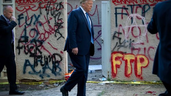 US President Donald Trump walks back to the White House escorted by the Secret Service after appearing outside of St John's Episcopal church across Lafayette Park in Washington, DC on June 1, 2020. US President Donald Trump was due to make a televised address to the nation on Monday after days of anti-racism protests against police brutality that have erupted into violence. The White House announced that the president would make remarks imminently after he has been criticized for not publicly addressing in 