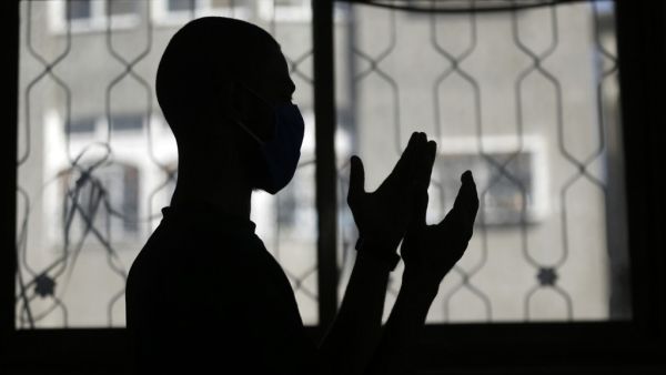 A mask-clad Palestinian man takes part in the noon (Dhuhr) prayers at the Al-Abrar mosque in Rafah in the sothern Gaza Strip on June 3, 2020, after local authorities who had shut down mosques due to the coronavirus allowed them to reaopen. SAID KHATIB / AFP