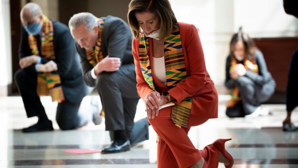 Speaker of the House Nancy Pelosi (D-CA) and other Democratic lawmakers take a knee to observe a moment of silence on Capitol Hill for George Floyd and other victims of police brutality June 8, 2020, in Washington, DC. Democrats kneeled in silence in the US Congress on Monday as they observed an eight minute, 46 second tribute to George Floyd and other black Americans "who have unjustly lost their lives." House Speaker Nancy Pelosi and Senate minority leader Chuck Schumer were joined by two dozen lawmakers 
