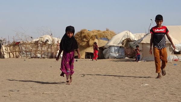  In this file photo taken on May 06, 2020 Children walk past tents at a displaced persons camp in the Khokha district of Yemen's western province of Hodeida. The world is facing an "impending global food emergency" that could impact hundreds of millions of people as the coronavirus pandemic threatens already strained supply chains, UN Secretary-General Antonio Guterres warned Tuesday. Khaled ZIAD / AFP