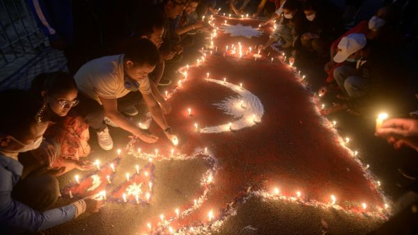 People light candles as they celebrate after the parliament approved a new national emblem with a controversial political map that includes strategic territories disputed with its giant neighbour India, in Kathmandu on June 13, 2020. Nepal's lower house of parliament on June 13 approved a new national emblem with a controversial political map that includes strategic territories disputed with its giant neighbour India. PRAKASH MATHEMA / AFP