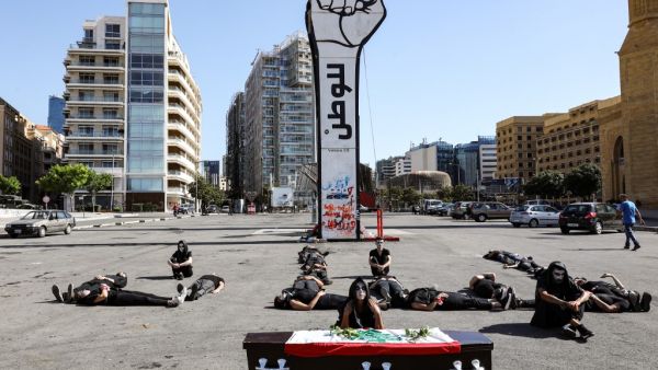 Lebanese anti-government protesters take part in a symbolic funeral for the country in the downtown area of the capital Beirut, on June 13, 2020, on the third consecutive day of demonstrations due to a deepening economic crisis. ANWAR AMRO / AFP