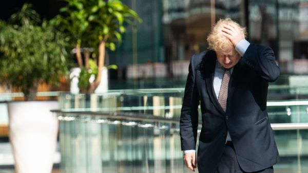 Britain's Prime Minister Boris Johnson visits Westfield shopping centre in east London on June 14, 2020 to see the coronavirus measures in place in advance of the reopening tomorrow. A variety of English shops and some outdoor attractions are set to open tomorrow for the first time in nearly three months, as Britain continues to ease its coronavirus lockdown. John NGUYEN / POOL / AFP