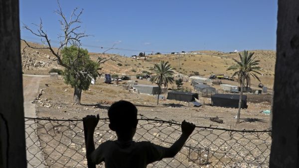 A Palestinian child stands at his family land east of Tubas in the Jordan Valley on June 15, 2020. Israel intends to annex West Bank settlements and the Jordan Valley, as proposed by US President Donald Trump, with initial steps slated to begin from July 1.  JAAFAR ASHTIYEH / AFP
