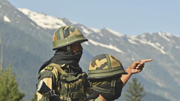 Indian Border Security Force (BSF) soldiers guard a highway leading towards Leh, bordering China, in Gagangir on June 17, 2020. India is sending hundreds of extra troops towards the Chinese border, sources told AFP on June 17, after the deadliest clashes in over 50 years between the two Asian giants left 20 Indian soldiers dead following brawls with fists, rocks and clubs. Tauseef MUSTAFA / AFP Indian Border Security Force (BSF) soldiers guard a highway leading towards Leh, bordering China, in Gagangir on June 17, 2020. India is sending hundreds of extra troops towards the Chinese border, sources told AFP on June 17, after the deadliest clashes in over 50 years between the two Asian giants left 20 Indian soldiers dead following brawls with fists, rocks and clubs. Tauseef MUSTAFA / AFP