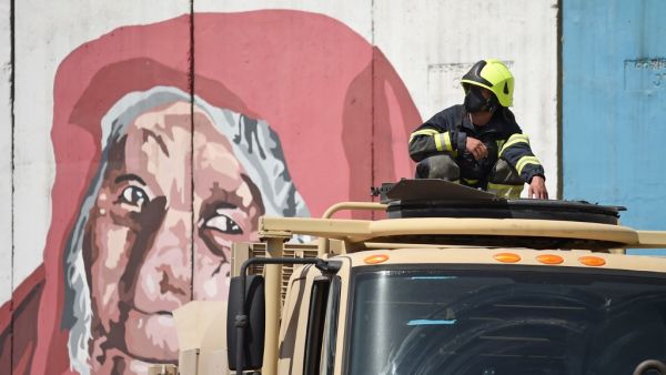 A firefighter from the government emergency committee sits on the rooftop of a vehicle before spraying disinfectant on a street as a preventive measure against the spread of COVID-19 coronavirus, in Kabul June 18, 2020. Early optimism that South Asia might have dodged the worst ravages of the coronavirus pandemic has disappeared as soaring infection rates turn the densely populated region into a global hot spot. After several months trailing the US and western Europe, cases of COVID-19 are surging across So