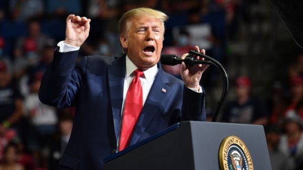 US President Donald Trump speaks during a campaign rally at the BOK Center on June 20, 2020 in Tulsa, Oklahoma. Hundreds of supporters lined up early for Donald Trump's first political rally in months, saying the risk of contracting COVID-19 in a big, packed arena would not keep them from hearing the president's campaign message. Nicholas Kamm / AFP