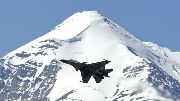 An Indian fighter jet flies over a mountain range near Leh, the joint capital of the union territory of Ladakh, on June 23, 2020. India's Prime Minister Narendra Modi said on June 19 that his country was "hurt and angry" after a border clash with China that left 20 troops dead, and warned that the army has been given free reign to respond to any new violence. Tauseef MUSTAFA / AFP