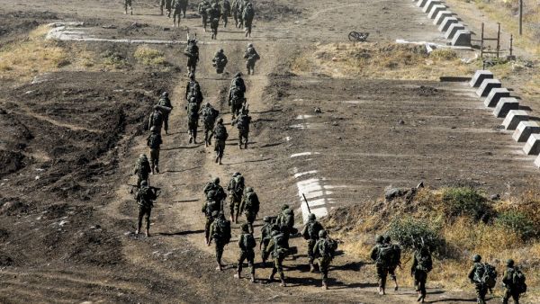 Israeli army soldiers take part in a military drill in the Israeli-annexed Golan Heights on June 24, 2020. JALAA MAREY / AFP