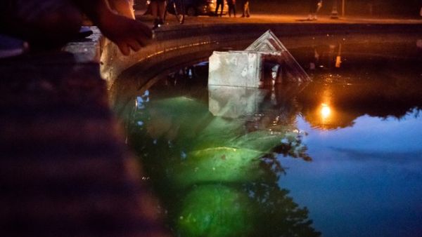 A statue of Christopher Columbus in Byrd Park has been removed by protesters and dragged into the lake (Twitter)