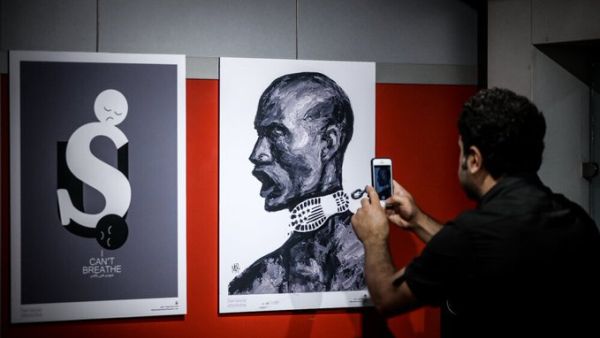 The international cartoon exhibition “I Can’t Breathe”,highlighting protests against racism in the U.S.,opened in the Aali Gallery of the Art Bureau in Tehran. (Twitter)