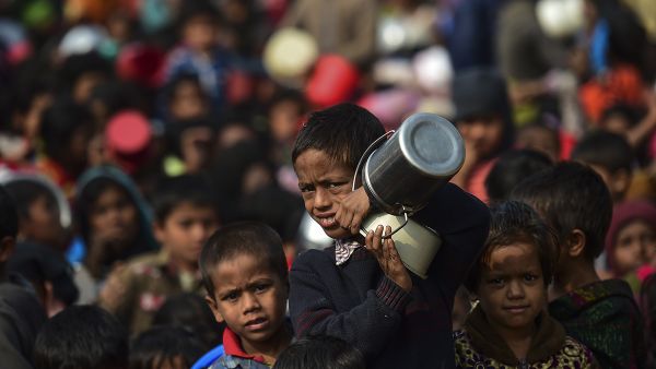 A Rohingya Muslim refugee waits with others for food aid at Thankhali refugee camp in Bangladesh's Ukhia district on January 12, 2018. (AFP Photo/Munir Uz Zaman) A Rohingya Muslim refugee waits with others for food aid at Thankhali refugee camp in Bangladesh's Ukhia district on January 12, 2018. (AFP Photo/Munir Uz Zaman)
