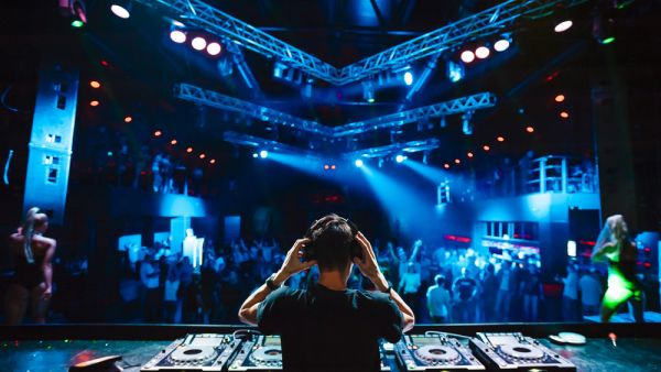 DJ with headphones at night club. (Shutterstock/ File Photo)