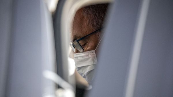 Israeli Prime Minister Benjamin Netanyahu, clad in mask due to the COVID-19 coronavirus pandemic, sits in his car after attending a graduation ceremony for new pilots in Hatzerim air force base near the southern Israeli city of Beersheba, on June 25, 2020. Ariel Schalit / POOL / AFP