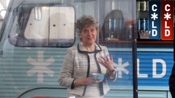 Scotland's First Minister, Nicola Sturgeon beside a screen which has been erected around tables during a visit to Cold Town House in Edinburgh's Grassmarket in Edinburgh on July 3, 2020, where she saw the changes in place to keep staff and customers safe in the outdoor hospitality industry as Scotland prepares for a further loosening of the COVID-19 lockdown. Andrew Milligan / POOL / AFP