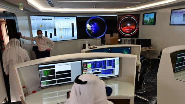 Employees work at the control room of the Mars Mission at the Mohammed Bin Rashid Space Centre (MBRSC), in the Gulf emirate of Dubai. The oil-rich United Arab Emirates has built a nuclear power programme and sent a man to space, and now plans to join another elite club by sending a probe to Mars. GIUSEPPE CACACE / AFP