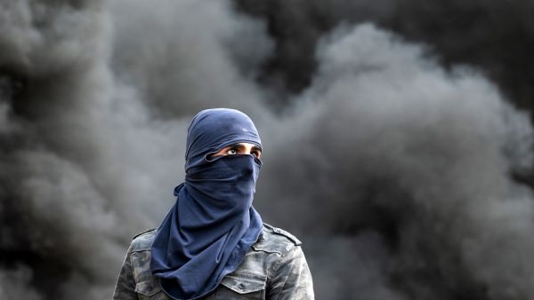 A Palestinian demonstrator is pictured during clashes following the funeral of 29-year-old Palestinian Ibrahim Abou Yacoub, who was killed by Israeli forces, in the village of Kifl Hares, south of the West Bank city of Nablus on July 10, 2020. Israeli troops killed a Palestinian civilian in the West Bank on July 9, the Palestinian health ministry said. The ministry did not give any details as to the circumstances of the killing, stating only that "a civilian was killed by Israeli forces" after being shot in