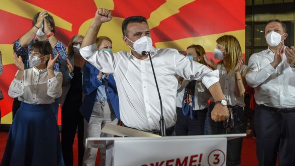 Zoran Zaev, leader of the ruling SDSM party, wears a facemask as he celebrates victory during general elections in Skopje early on July 16, 2020. North Macedonia's Social Democrats were locked in a tight battle for first place with nationalist rivals, preliminary results of elections showed, highlighting deep fault lines in the Balkan state. Robert ATANASOVSKI / AFP