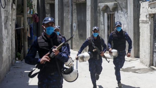 Palestinian security forces patrol an area in Gaza City on July 18, 2020, during a lockdown imposed to stop the spread the COVID-19 coronavirus pandemic. MAHMUD HAMS / AFP
