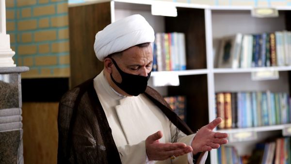 An Iranian cleric prays at a mosque in the capital Tehran, amid the ongoing novel coronavirus pandemic crisis, on July 19, 2020. Iran's president said yesterday that 35 million Iranians may contract the coronavirus, as the country still did not have herd immunity although a quarter of the population may have already been infected. The country has been battling a resurgence of COVID-19, with figures showing a rise in both new infections and deaths since a two-month low in May. ATTA KENARE / AFP