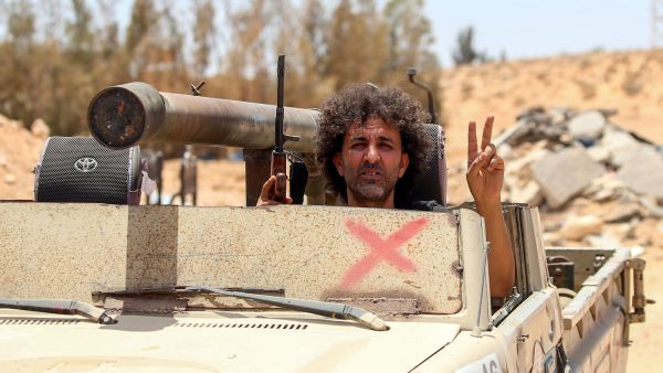 Fighters loyal to the UN-recognised Libyan Government of National Accord (GNA) secure the area of Abu Qurain, half-way between the capital Tripoli and Libya's second city Benghazi, against forces loyal to Khalifa Haftar, who is based in eastern Benghazi, on July 20, 2020. Mahmud TURKIA / AFP