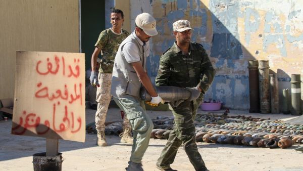 Military engineers, of the UN-recognised Libyan Government of National Accord (GNA), sort ammunition and explosives, uncovered from areas south of the capital, ahead of disposing of them in the Libyan capital Tripoli on July 22, 2020. Mahmud TURKIA / AFP
