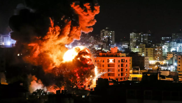 Fire and smoke billow above buildings in Gaza City during reported Israeli strikes on March 25, 2019. (Mahmud Hams / AFP)