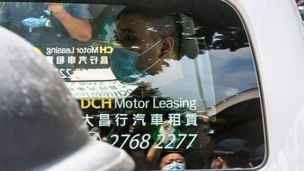 Mr Tong, who carried a 'Liberate Hong Kong' sign as he drove a motorcycle into police at a protest against the territory's Chinese rulers, became on Frida the first person charged with inciting separatism and terrorism under the new security law. (AFP/File)