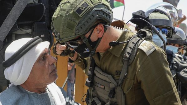 An Israeli border guard faces off with an elderly Palestinian man taking part in a demonstration to protest Israel's plan to annex parts of the occupied West Bank, in the Palestinian village of Haris, southwest of Nablus, on July 24, 2020. JAAFAR ASHTIYEH / AFP