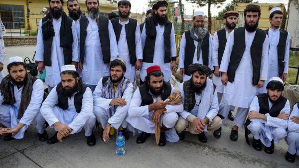 Taliban prisoners pose as they are in the process of being potentially released from Pul-e-Charkhi prison, on the outskirts of Kabul on July 31, 2020. Afghan President Ashraf Ghani on July 31 ordered the release of 500 Taliban prisoners as part of a new ceasefire that could lead into long-delayed peace talks. WAKIL KOHSAR / AFP