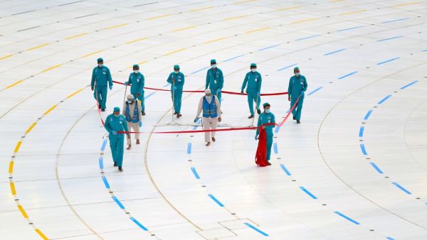 Workers clean and disinfect around the Kaaba on August 1, 2020, traced with lines for easing the physical distancing between pilgrims due to the coronavirus, during the evening before the last day of circumambulation around the shrine, in the Grand mosque of the holy Saudi city of Mecca, during the annual Muslim Hajj pilgrimage AFP