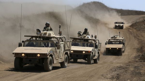 Israeli army training humvees equipped with mock cannon turrets drive during a drill in the Israeli-annexed Golan Heights, near Merom Golan on the border with Syria, on August 3, 2020. JALAA MAREY / AFP