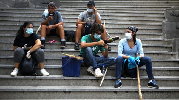 A Lebanese couple inspect the damage to their house in an area overlooking the destroyed Beirut port on August 5, 2020 in the aftermath of a massive explosion in the Lebanese capital. Rescuers searched for survivors in Beirut after a cataclysmic explosion at the port sowed devastation across entire neighbourhoods, killing more than 100 people, wounding thousands and plunging Lebanon deeper into crisis. The blast, which appeared to have been caused by a fire igniting 2,750 tonnes of ammonium nitrate left uns