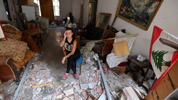 A woman sits amidst the rubble in her damaged house in the Lebanese capital Beirut on August 6, 2020, two days after a massive explosion shook the Lebanese capital. (AFP/ File Photo)