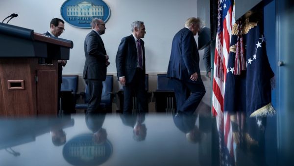 US Secretary of the Treasury Steven Mnuchin, Director of the Office of Management and Budget Russell Vought, member of the coronavirus task force Scott Atlas, and US President Donald Trump leave after a briefing at the White House August 10, 2020, in Washington, DC. Secret Service guards shot a person, who was apparently armed, outside the White House on Monday, President Donald Trump said just after being briefly evacuated in the middle of a press conference. The president was abruptly ushered out of the p