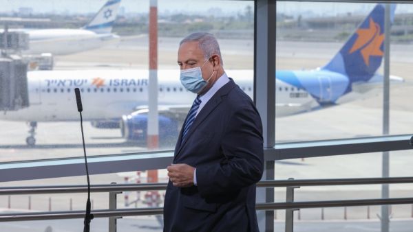 Israeli Prime Minister Benjamin Netanyahu arrives to make a speech during a visit to the Ben Gurion International Airport in Lod, on August 17, 2020. Emil Salman / POOL / AFP