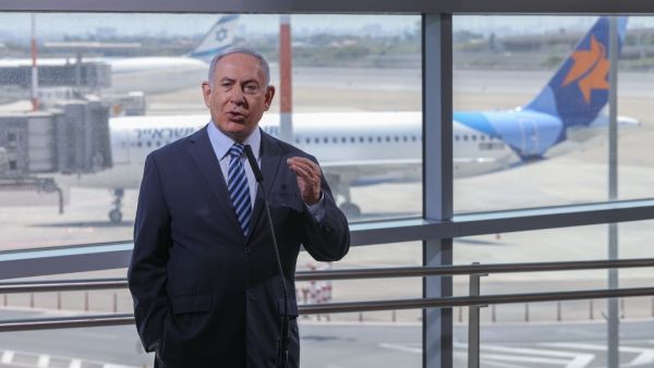 Israeli Prime Minister Benjamin Netanyahu speaks during a visit to the Ben Gurion International Airport in Lod, on August 17, 2020. Israel said on August 16 that citizens, residents and foreign workers returning from 20 countries would be exempted from a 14-day coronavirus quarantine period, but kept its borders closed to tourists. Emil Salman / POOL / AFP