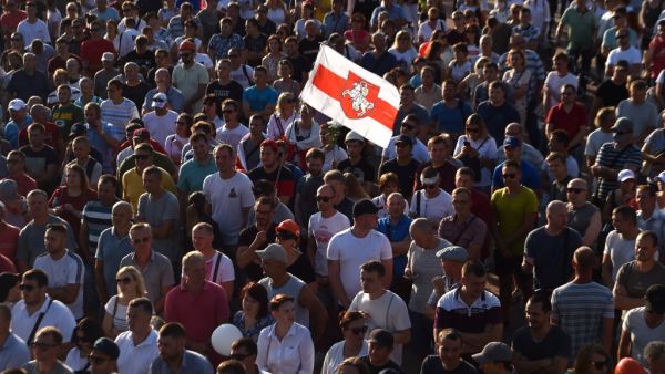 Belarus miners attend an opposition rally in Salyhorsk some 150 km south of Minsk, on August 17, 2020, after incumbent president rejected calls to step down in a defiant speech. The Belarusian strongman, who has ruled his ex-Soviet country with an iron grip since 1994, is under increasing pressure from the streets and abroad over his claim to have won re-election on August 9, with 80 percent of the vote. Sergei GAPON / AFP