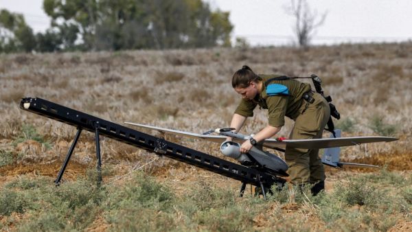 An Israeli soldier prepares an Elbit Systems Skylark I unmanned aerial vehicle (UAV or drone) for take-off near the border with the Gaza Strip in southern Israel on August 21, 2020, as part of monitoring operations in the area. JACK GUEZ / AFP