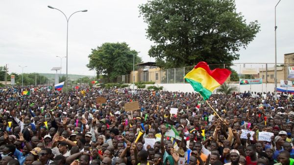 Demonstrators gather during a protest to support the Malian army and the National Committee for the Salvation of the People (CNSP) in Bamako, Mali, on August 21, 2020. Mali awoke on August 19, 2020, to a new chapter in its troubled history after rebel military leaders forced Malian President Boubacar Keita from office, prompting its West African neighbours to threaten border closures and sanctions against the coup leaders. ANNIE RISEMBERG / AFP