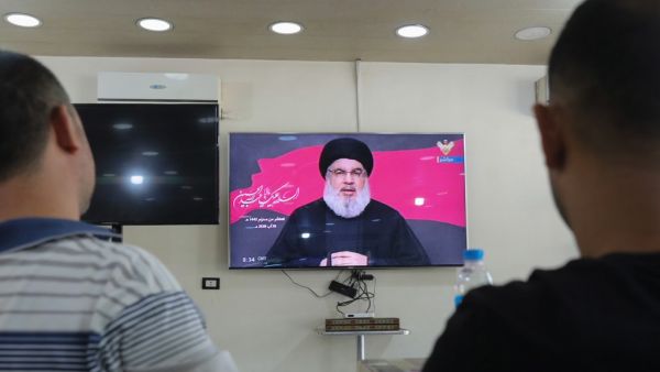 Lebanese men watch the head of the country's Shiite Muslim movement Hezbollah Hassan Nasrallah during a televised speech, at a coffee shop in the southern suburbs of the capital Beirut, on August 30, 2020, on the tenth day of the month of Muharram which marks the peak of Ashura. Ashura is a 10-day period of mourning in remembrance of the seventh-century martyrdom Imam Hussein, who was killed in the battle of Karbala in modern-day Iraq, in 680 AD. ANWAR AMRO / AFP